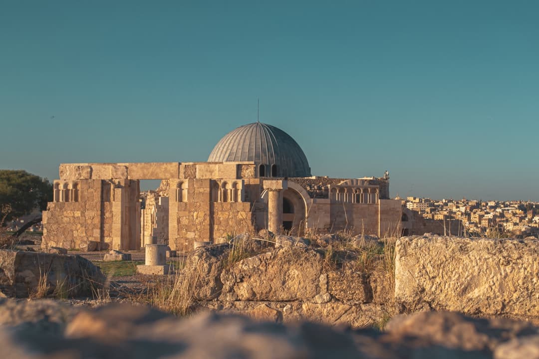 Columns of the Temple of Hercules on the Citadel hill, with Amman's white buildings spread out below