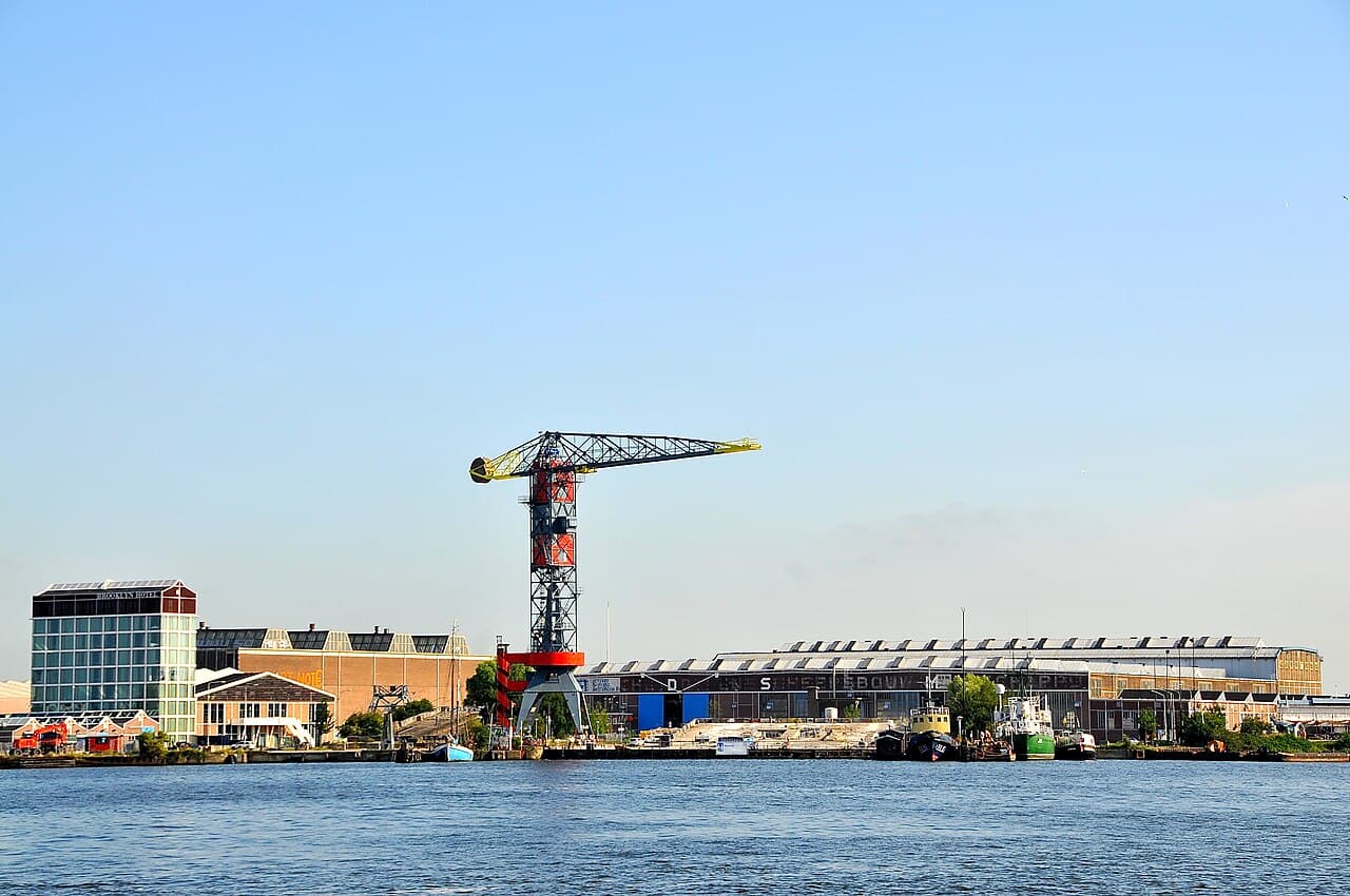 Giant street-art murals on warehouse walls at the NDSM shipyard