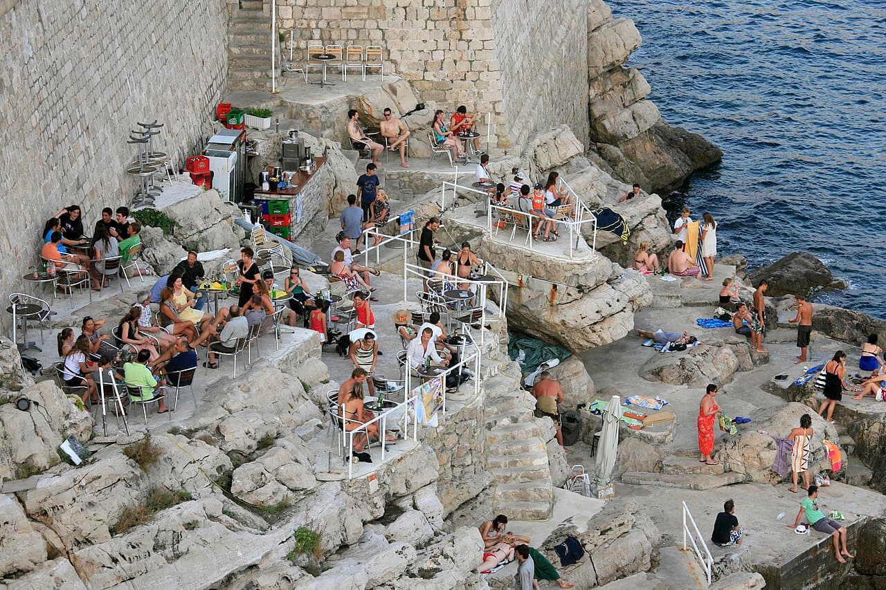 A cliffside Buža bar on the sea walls of Dubrovnik