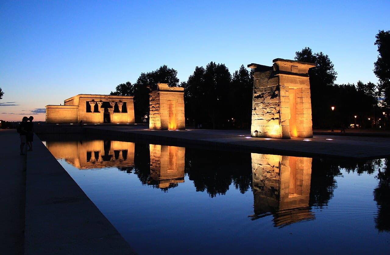 The Temple of Debod reflected in its pool at sunset in Madrid